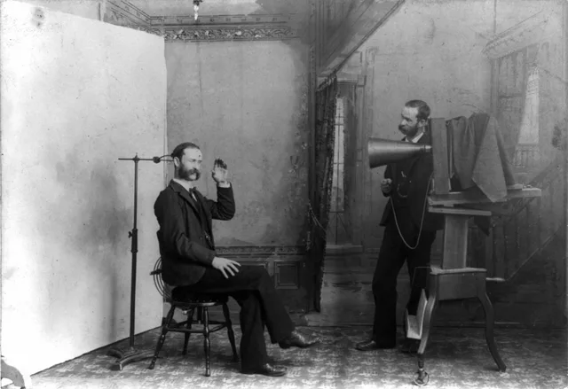 TITLE: A photographer appears to be photographing himself in a photographic studio: Wheeler, Berlin, Wis. A composite photograph showing a photographic studio interior. One man is seated on a stool near an adjustable clamp to hold his head steady during a long portrait exposure. The second man, stan. Do US portrait photographers need copyright registration before a DMCA takedown?