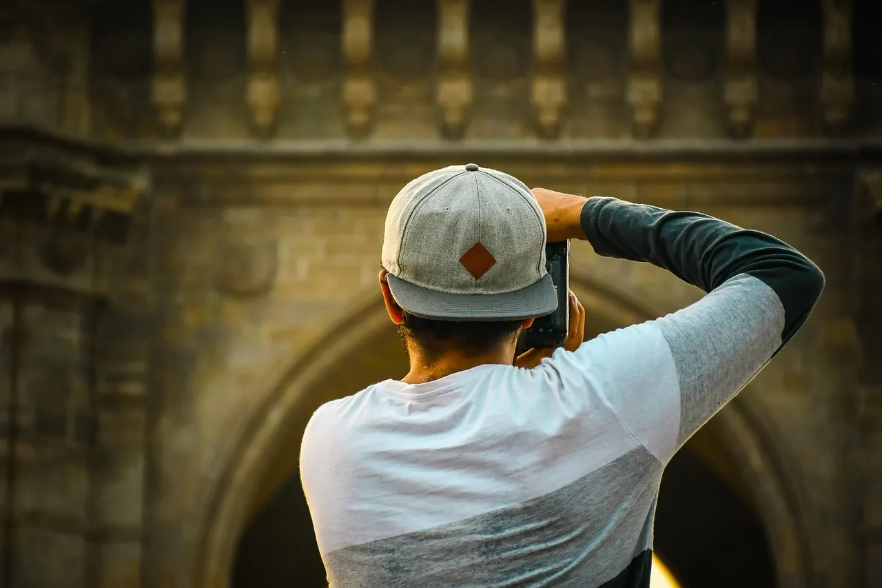 photographer, man, back, photographing, taking photo, photography, clicking, person, hobby, profession. Photography unit economics for owners for first-year owners